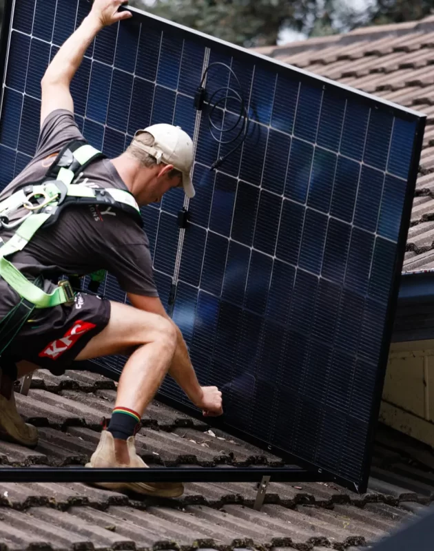 Avery Solar & Electrical technician installing REA solar panels